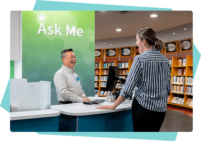 RPL staff helping a patron at the Ask Me desk