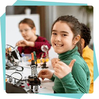 Children working on STEAM projects at a table together